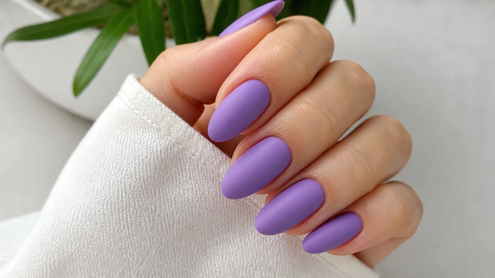 Solid lavender nails with a soft matte velvet finish, no shine