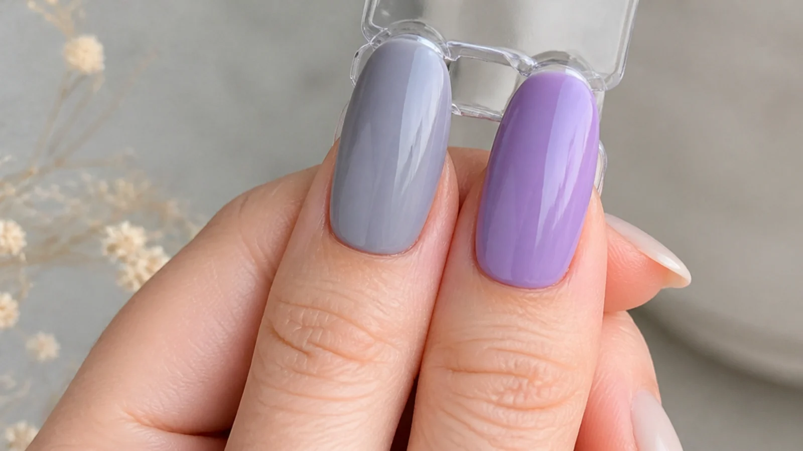 Soft gray-blue lavender nail beside a brighter light purple nail for comparison