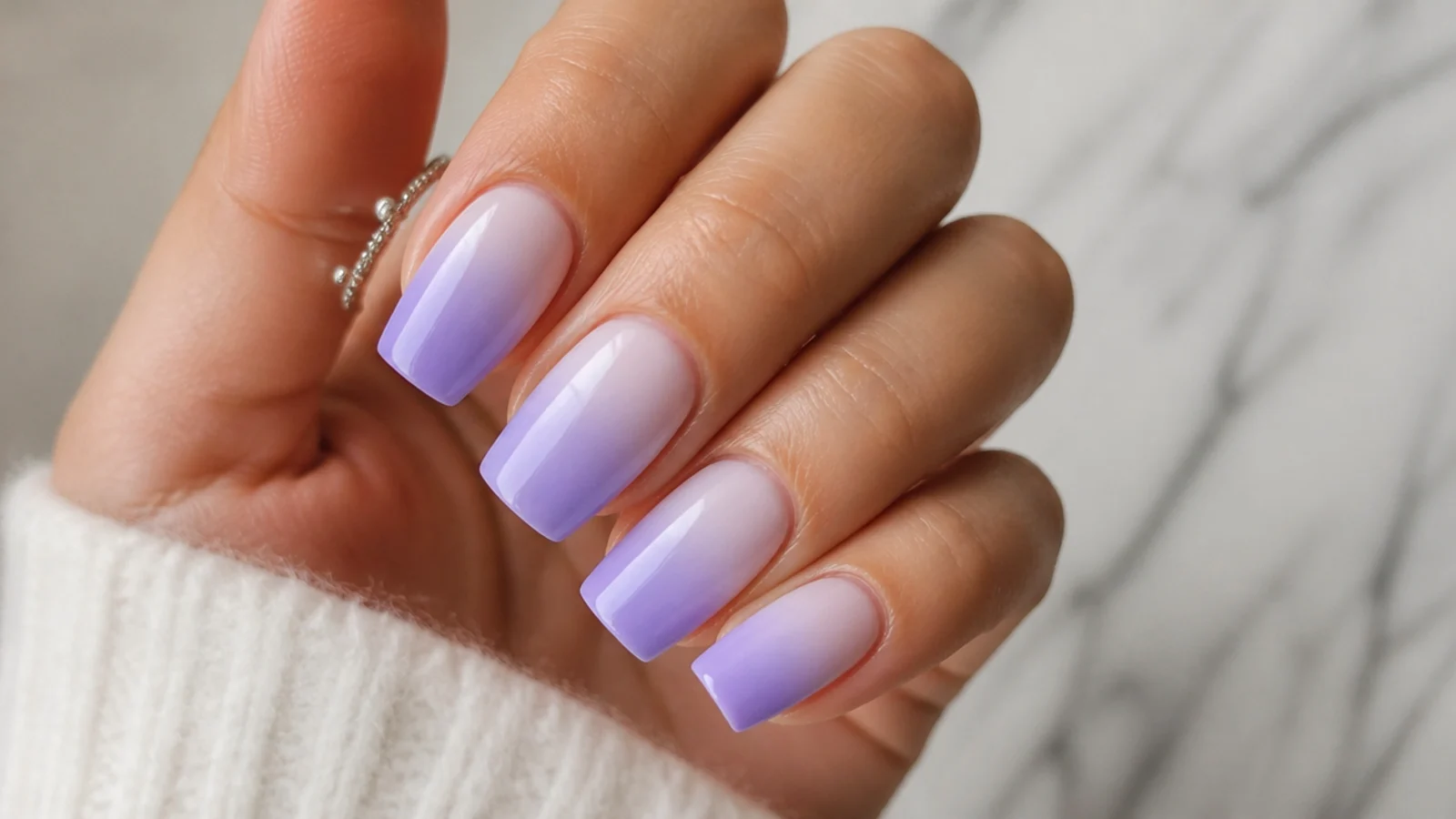 Cool true-lavender ombre nails fading tip to cuticle on square tips