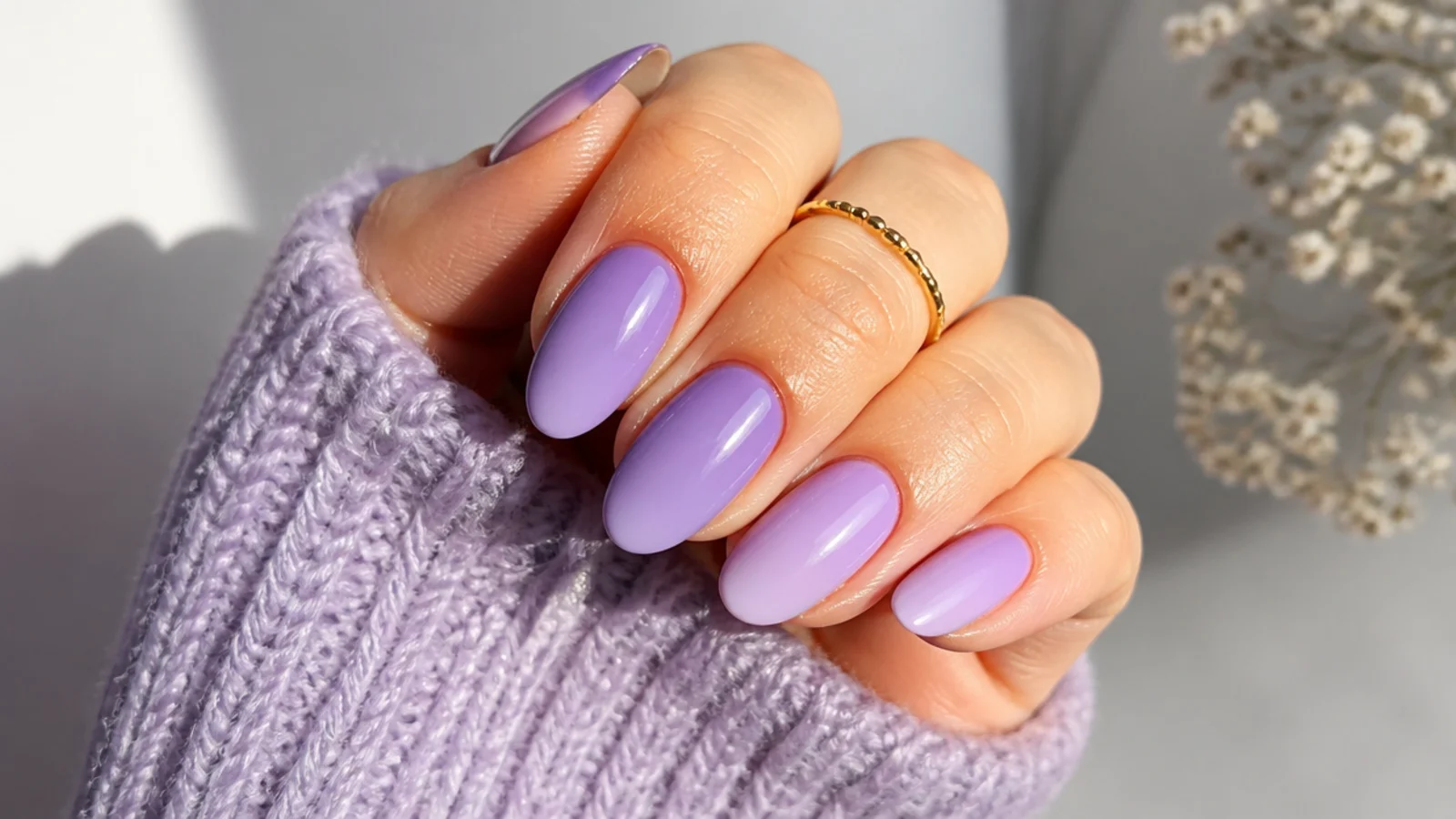 Tonal lavender ombre nails shifting from deeper lavender to pale lilac across the hand