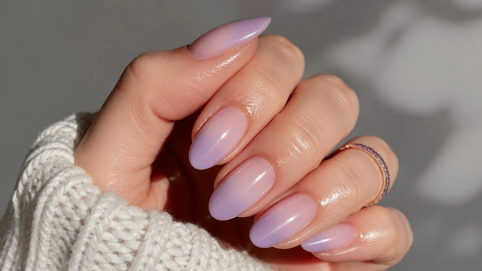 A well-sealed lavender ombre manicure with cuticle oil for longevity