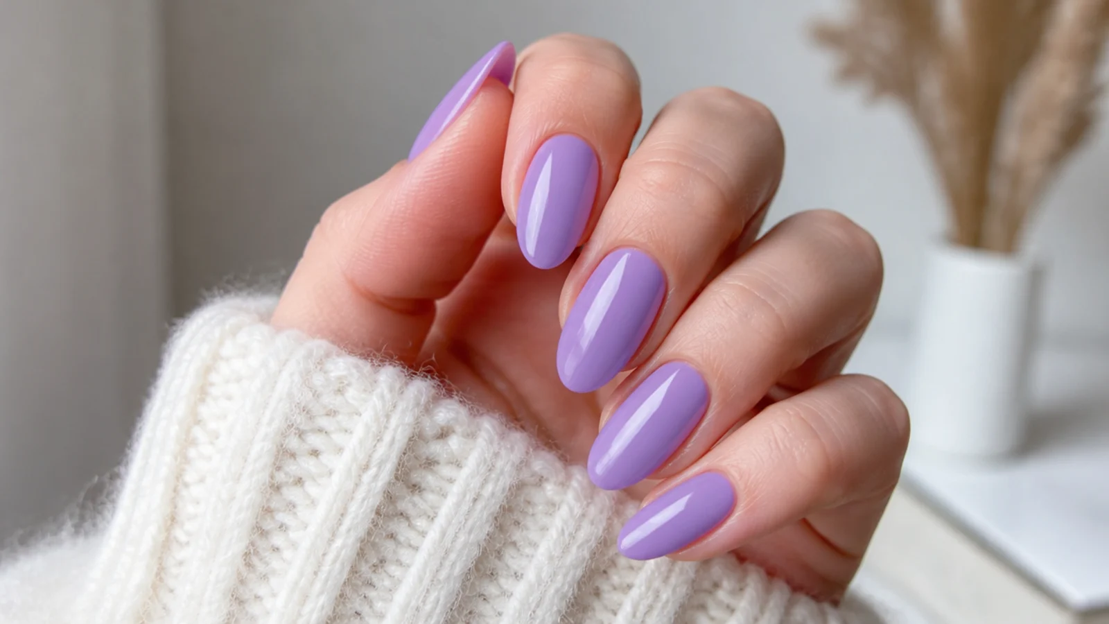 Cool true lavender glossy nails with a high-shine finish on fair skin