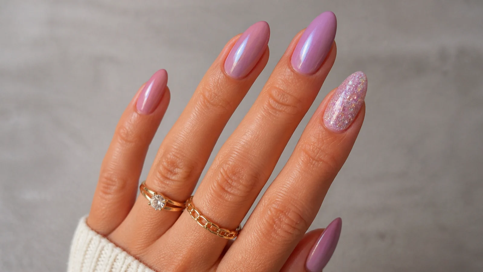 Warm pink-lavender nails with a soft rosy glow on tan skin