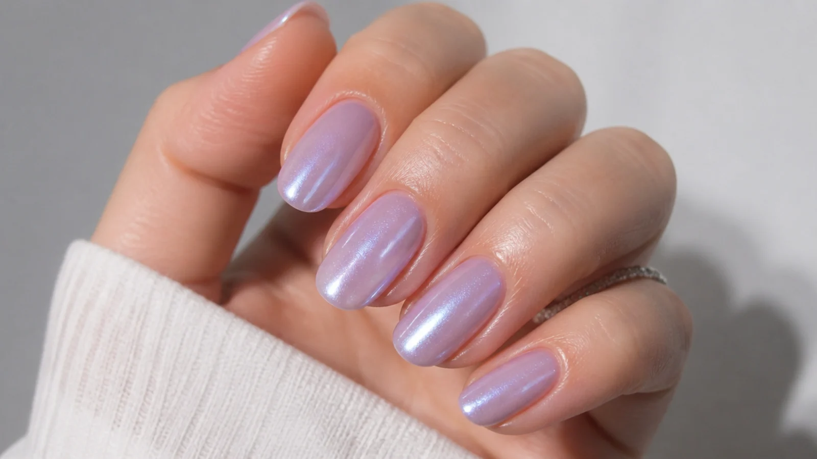 Pearly glazed lavender nails with a soft iridescent shimmer