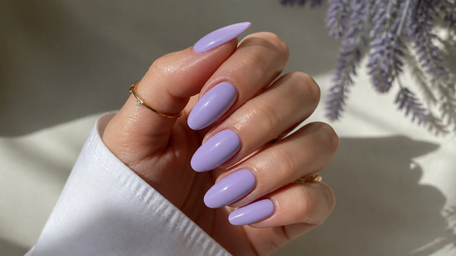Long lavender almond nails with a smooth glossy finish