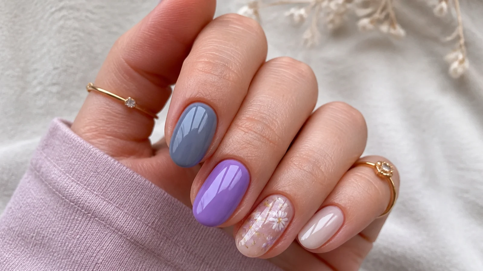 Soft gray-blue lavender nail beside a brighter light purple nail for comparison