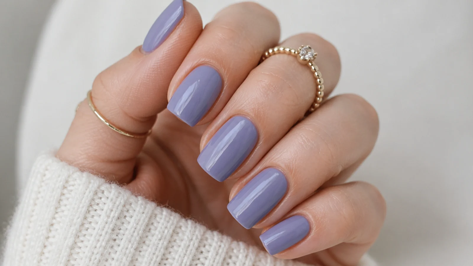 Solid cool-toned lavender nails with a gray-blue lilac undertone on squoval nails