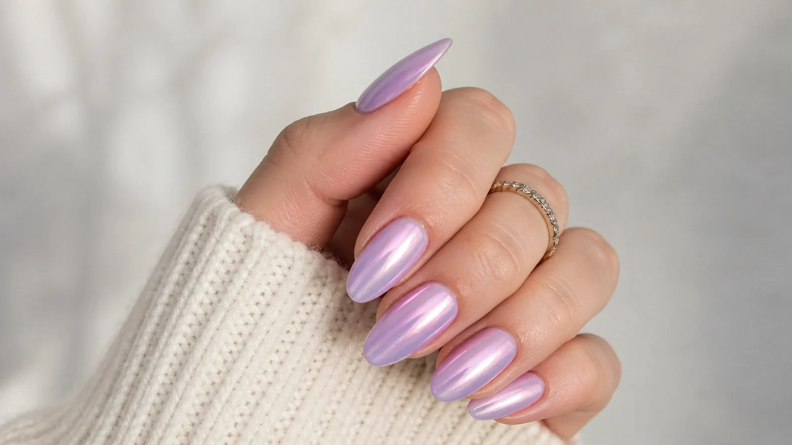 Pearly lavender chrome nails with a glazed-donut sheen on almond nails