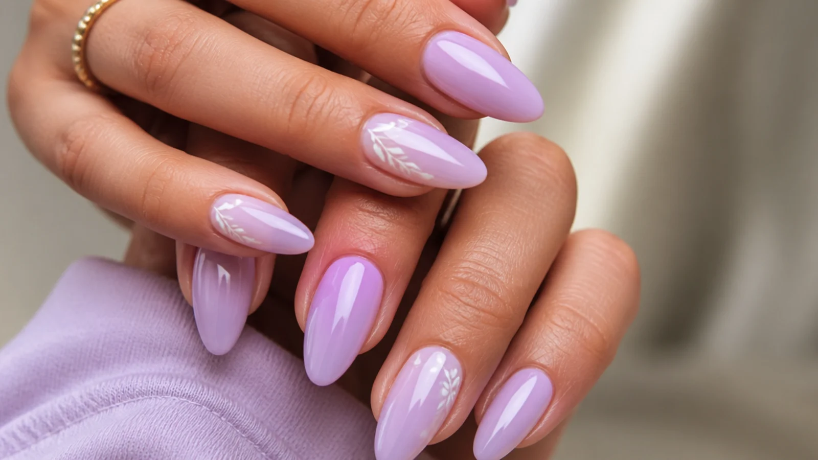 Long almond nails in soft light lavender with an elegant tapered shape