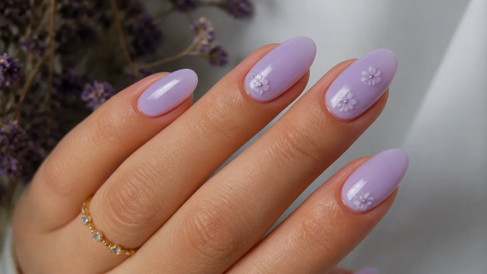 Soft light lavender nails on an almond shape with a milky lilac finish
