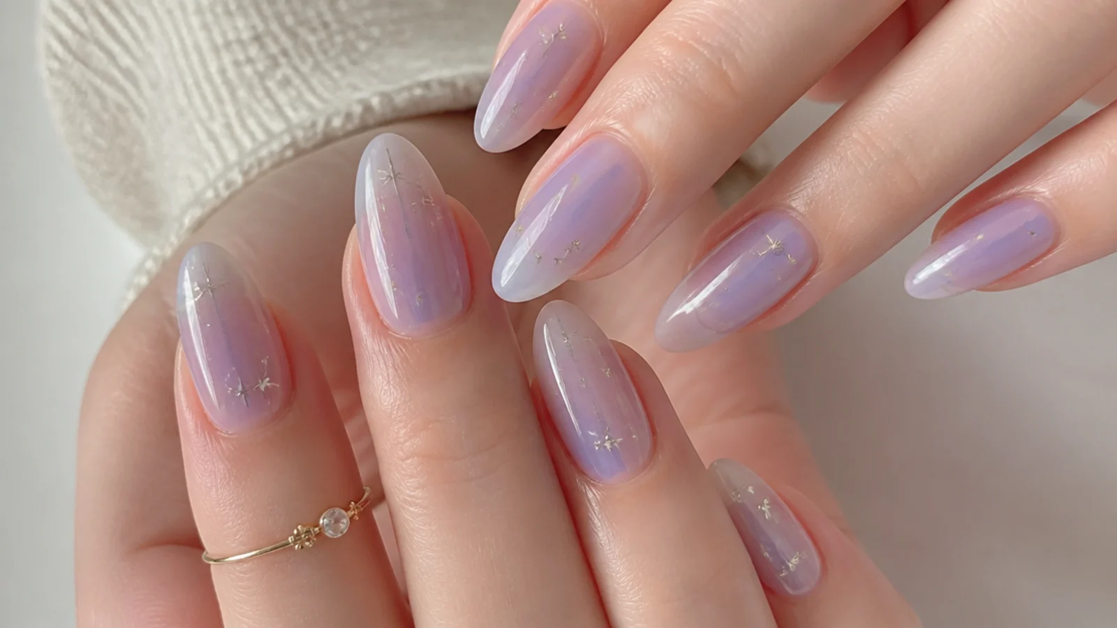 Translucent milky lavender jelly nails with a glossy see-through glow