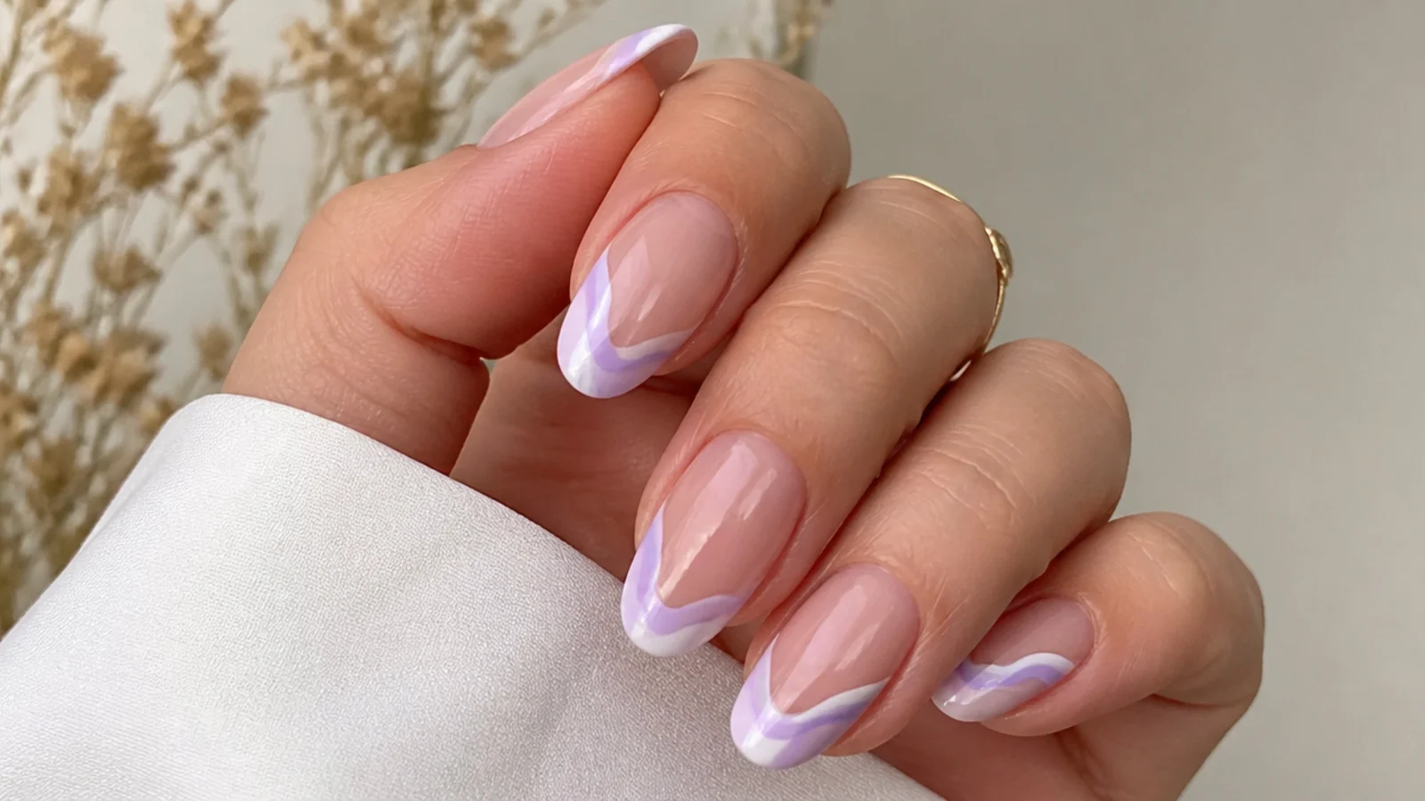 Sheer milky nails with lavender and white swirl tips