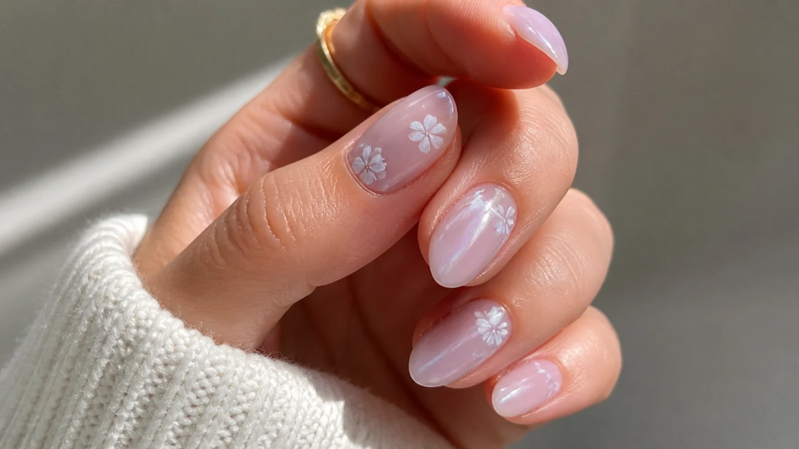 Sheer milky lavender nails on a short almond shape