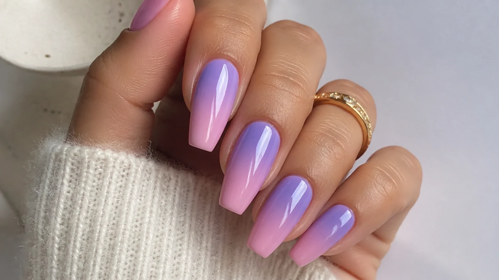 Lavender to soft pink ombre nails blending at the tips, coffin shape