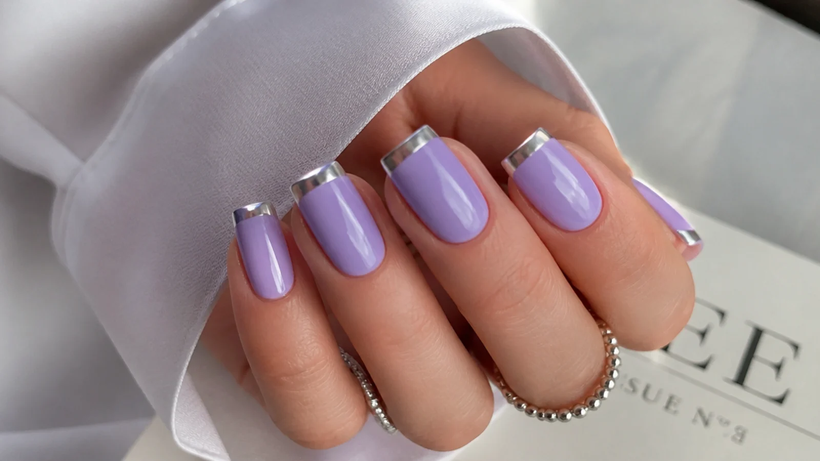Lavender nails with silver chrome accent tips on square nails