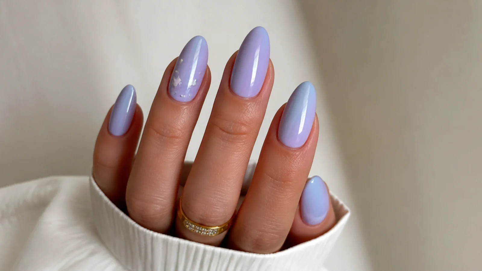 Soft ombre nails melting from lilac into baby blue