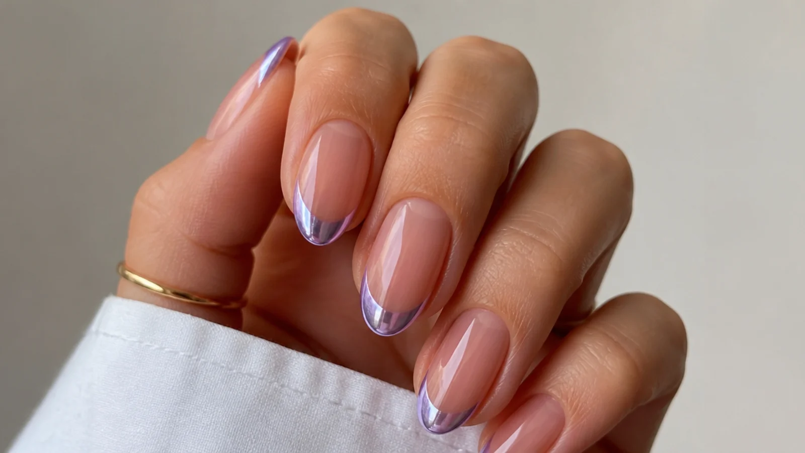 Sheer nails with mirror-like lilac chrome French tips