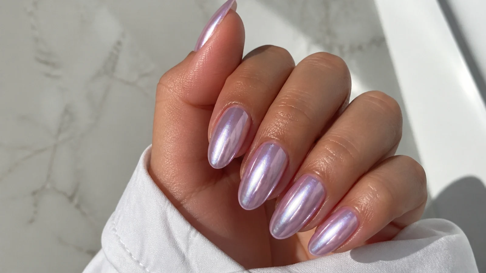 Glazed lavender chrome acrylic nails with a mirror sheen