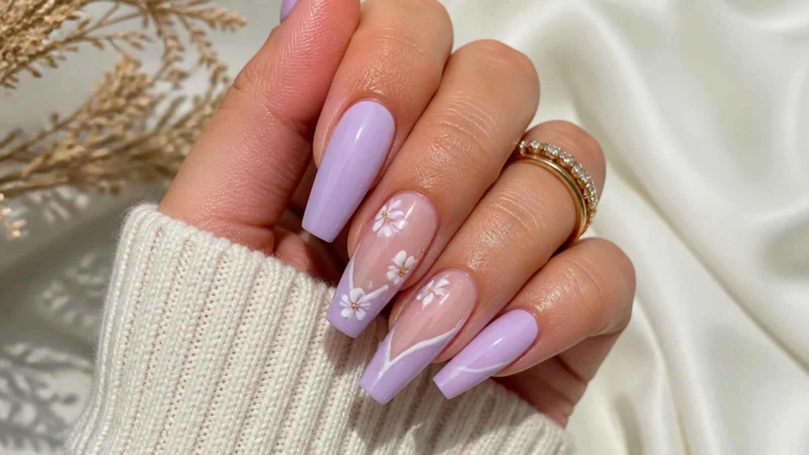 Long pastel purple acrylic nails in a coffin shape