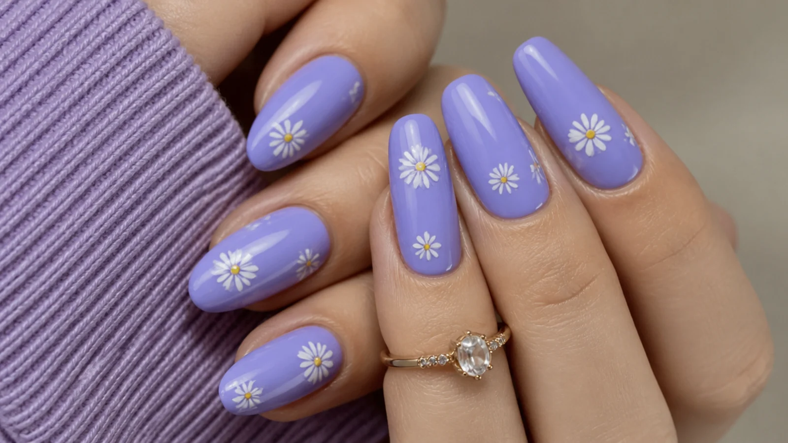 Blue-leaning periwinkle light purple acrylic nails on almond shape
