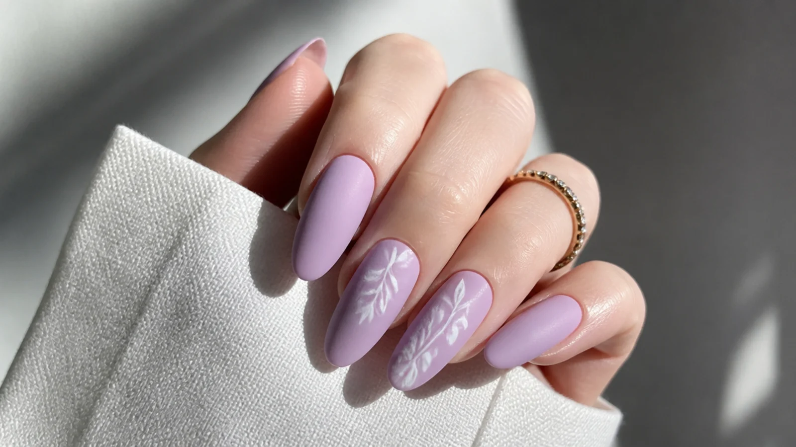 Matte soft lavender acrylic nails with a velvety finish
