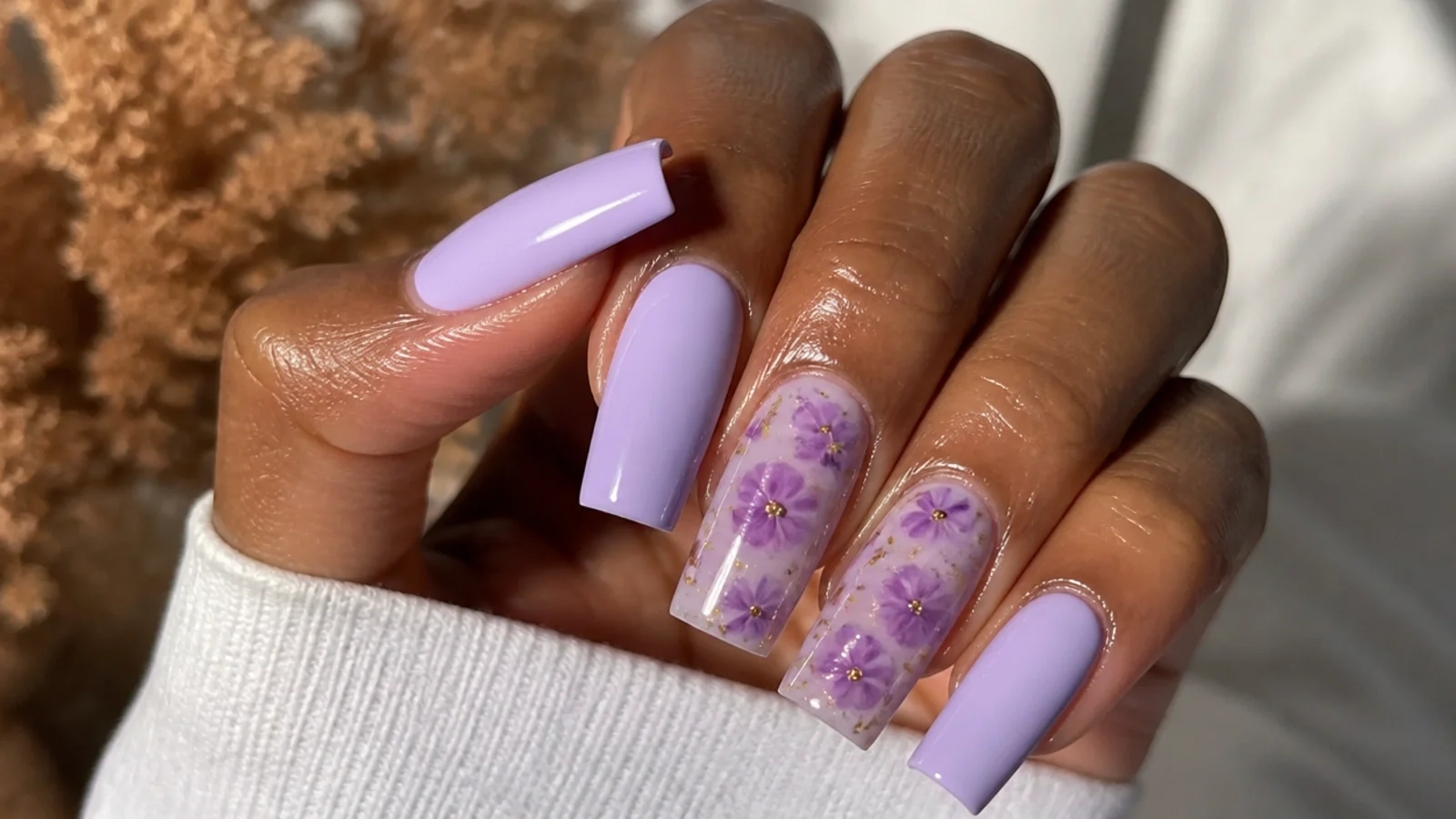 A well-maintained light purple acrylic set with cuticle oil for longevity