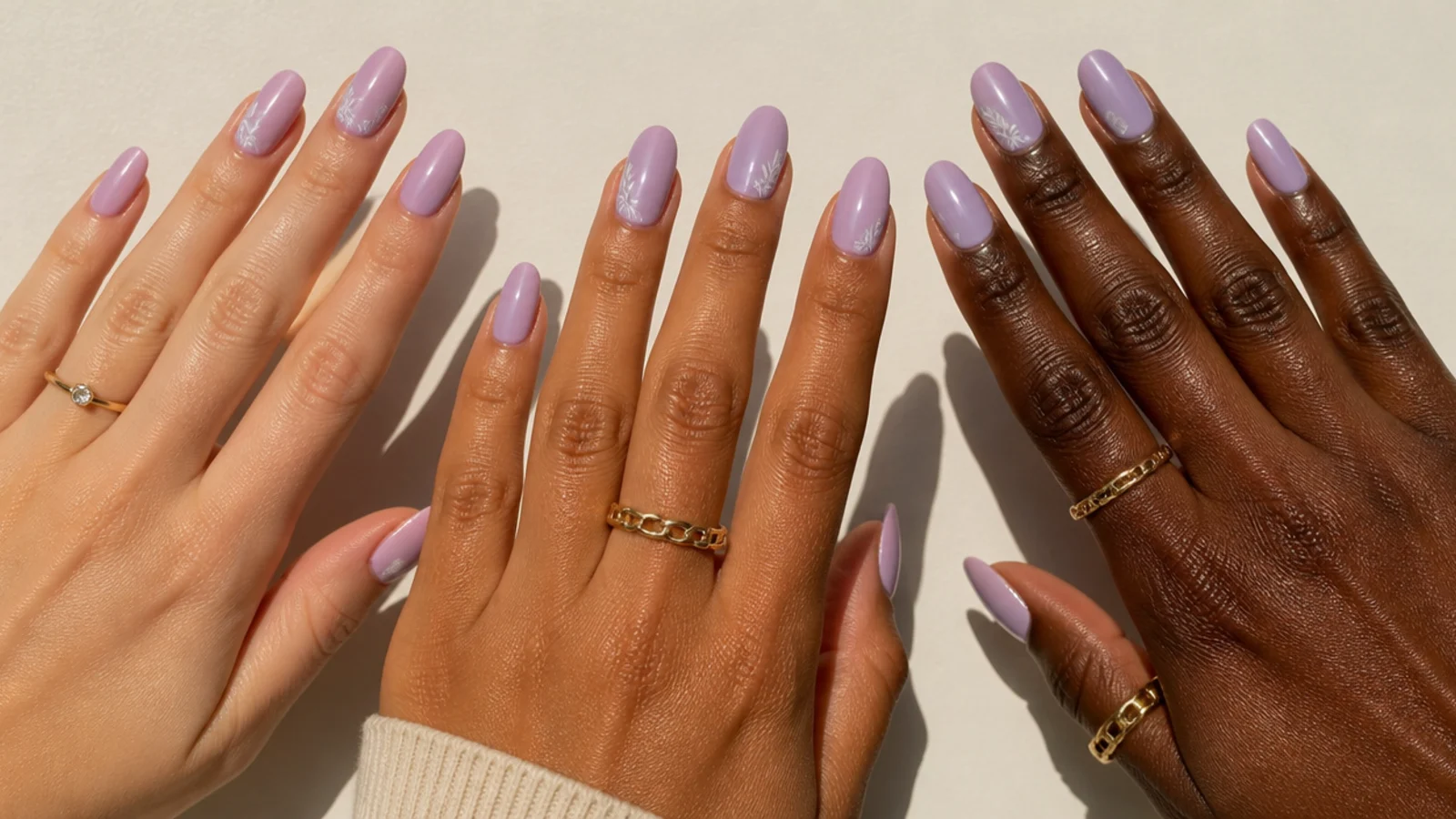 Three light purple swatches on fair, tan and deep hands for skin-tone matching