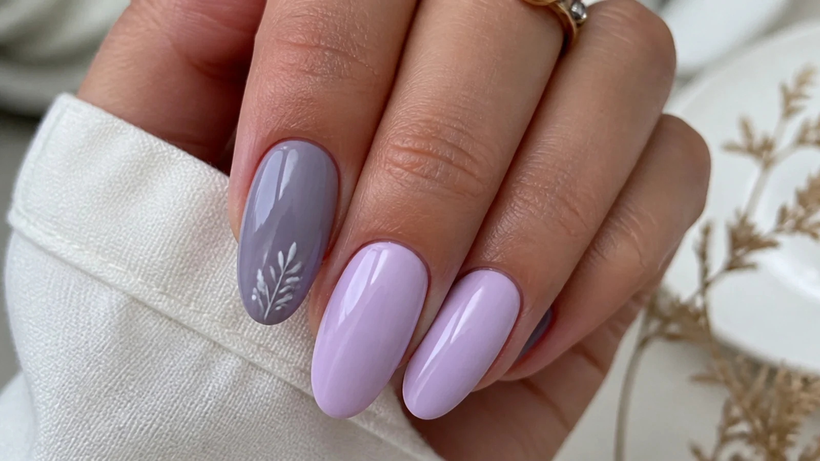 Lavender gray-blue purple nail beside a lighter lilac nail for comparison