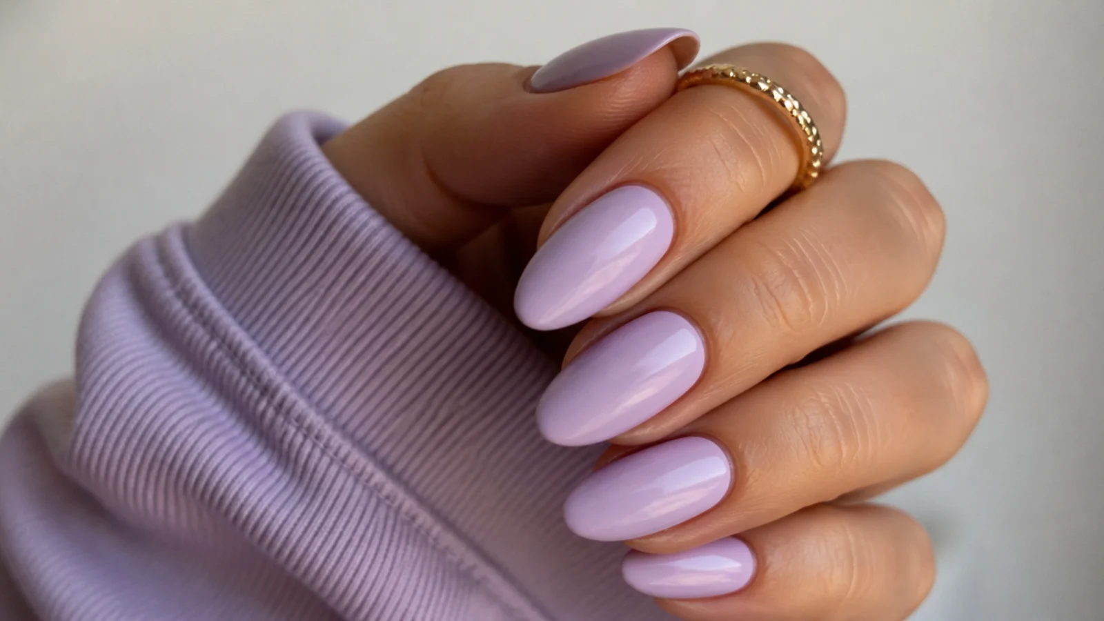Opaque soft lavender cream almond nails with a smooth matte-gloss finish