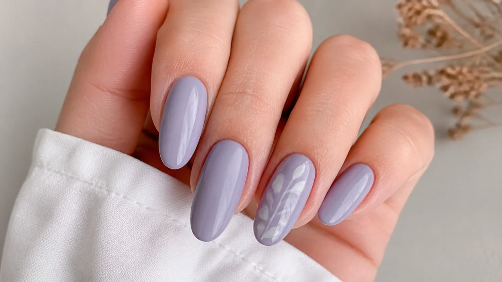 Muted grayed light purple almond nails with a modern dusty finish