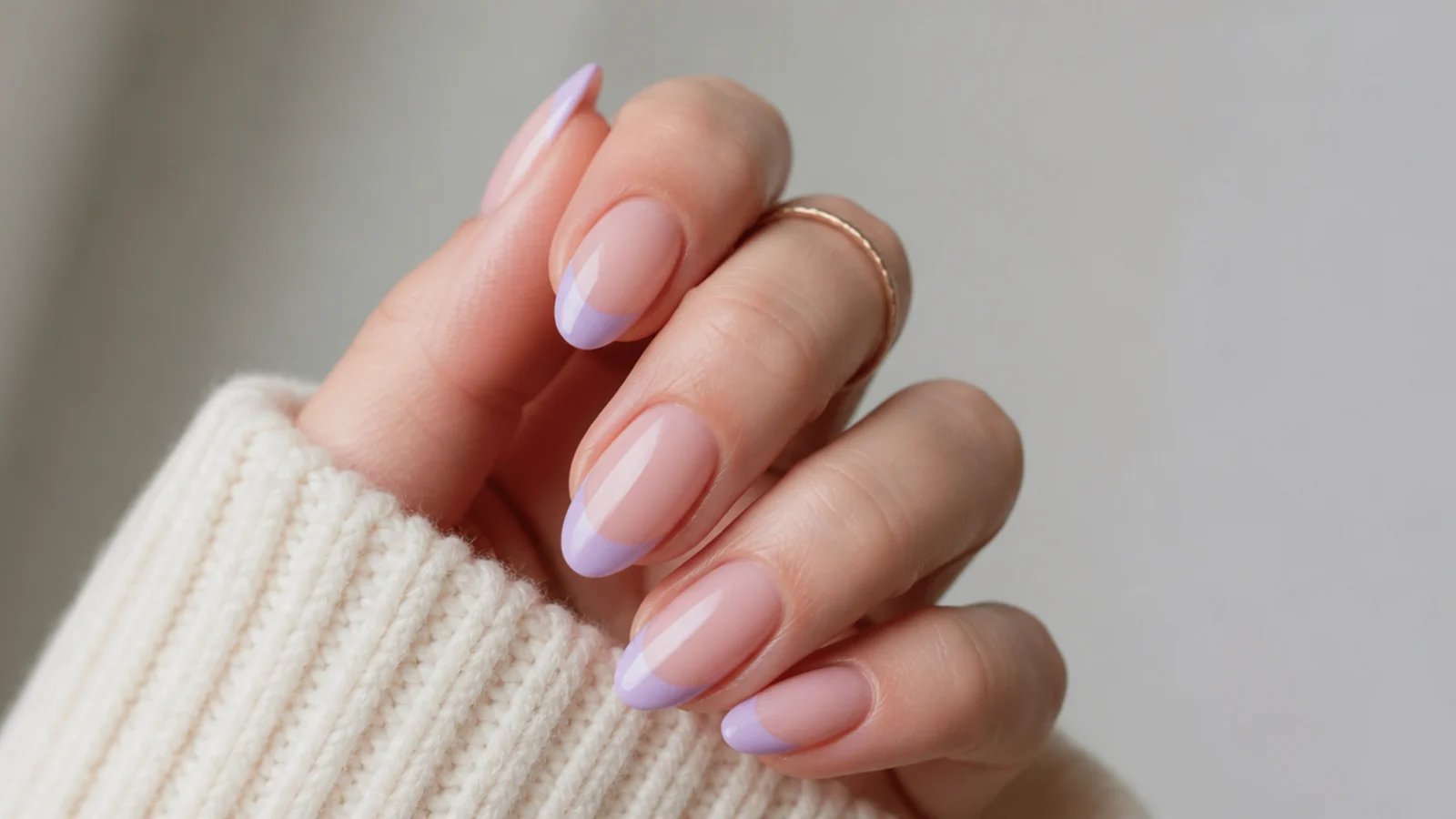 Sheer nude almond nails with soft light purple French tips