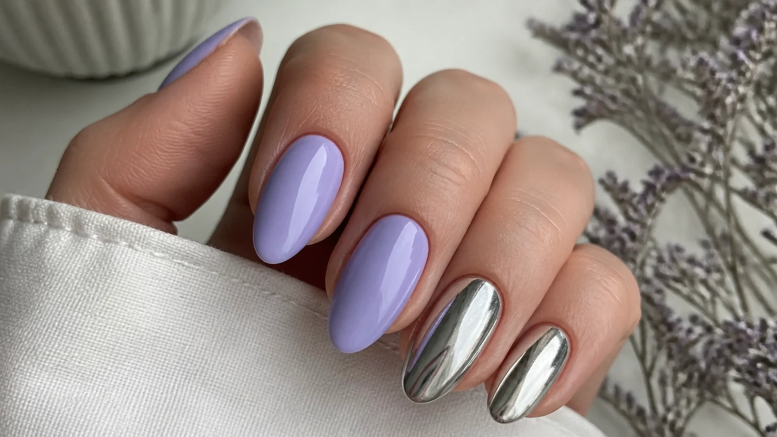 Light purple almond nails with silver chrome accent nails