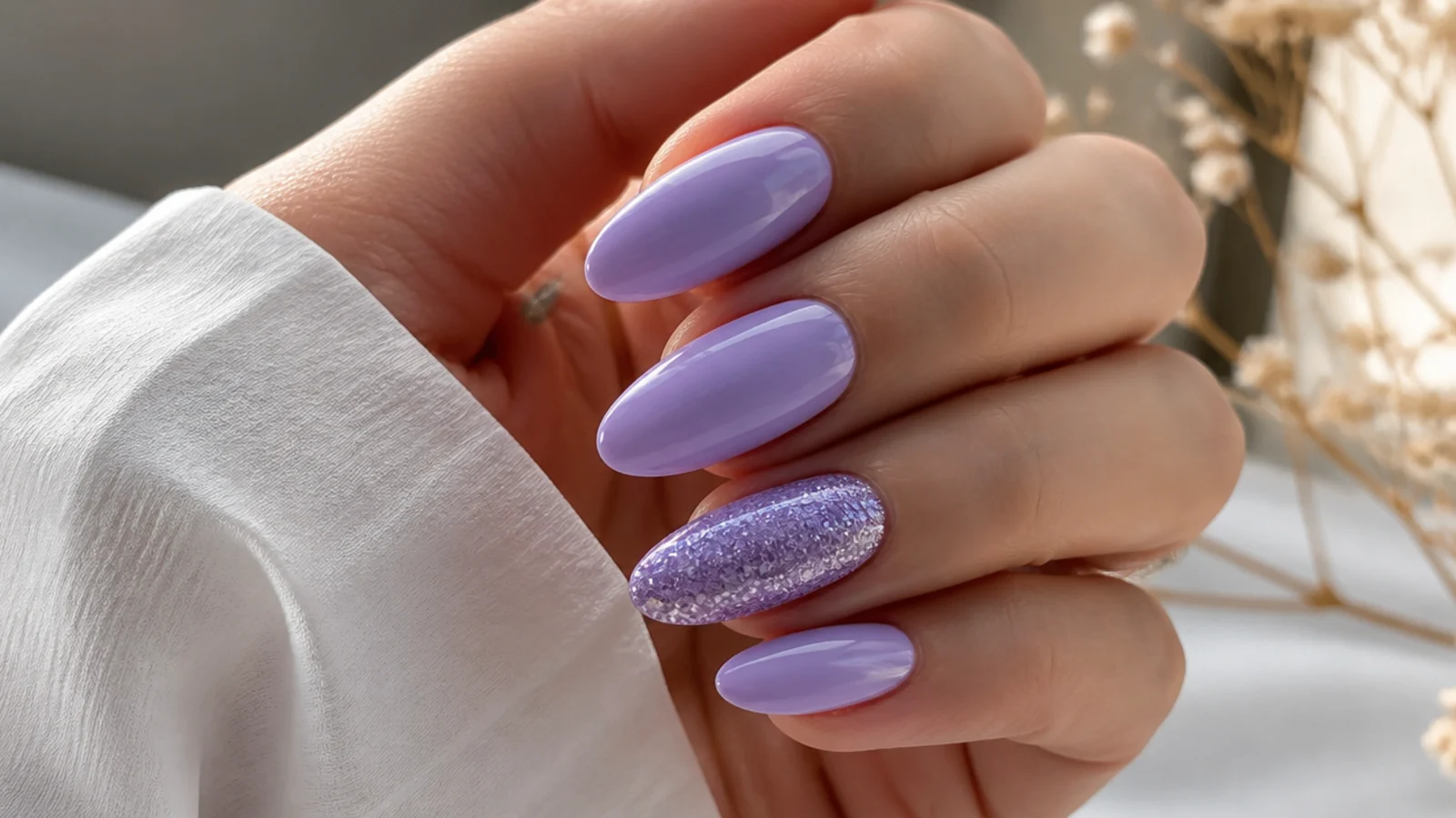 Soft light purple almond nails with one full glitter accent nail