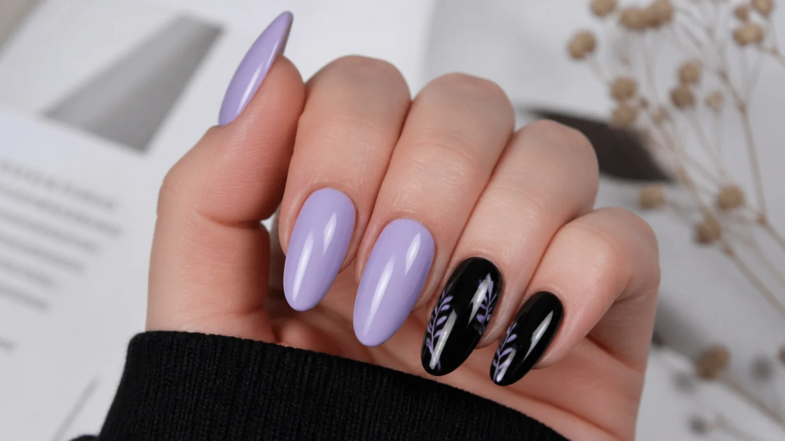 Soft light purple almond nails with glossy black accent nails