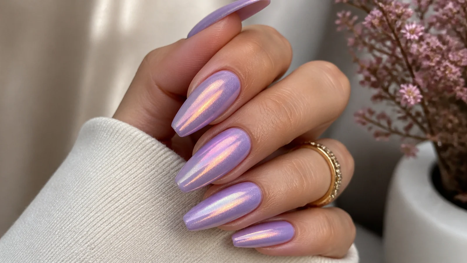 Light purple almond nails with a pearly iridescent color-shift finish