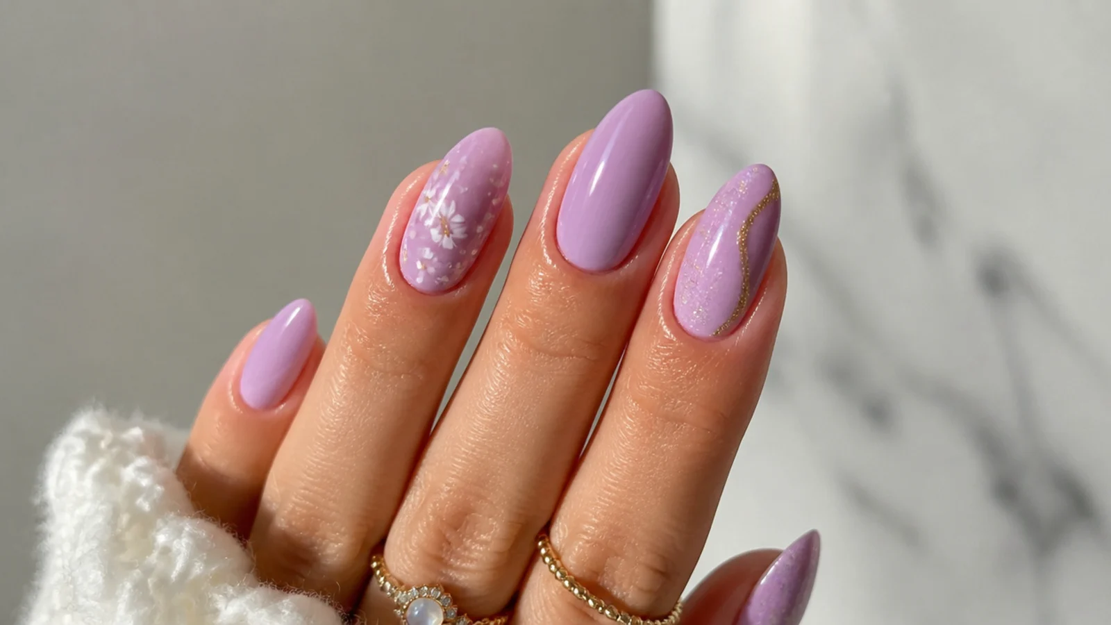 A well-sealed light purple almond manicure with cuticle oil for longevity