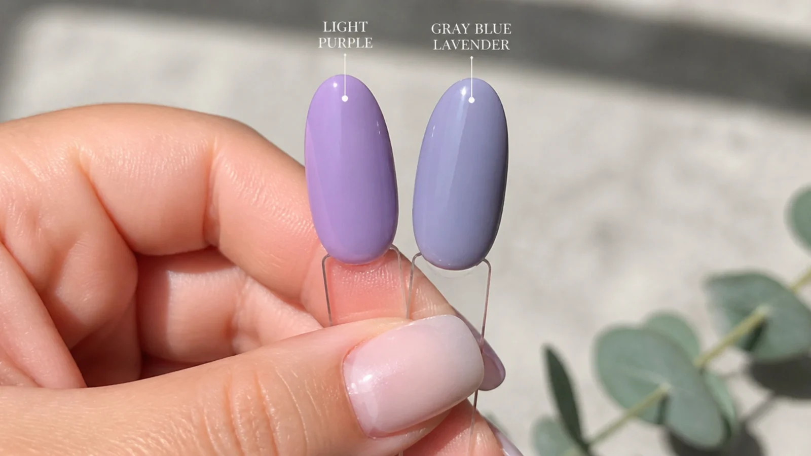 Two almond nail swatches comparing broad light purple beside specific gray-blue lavender