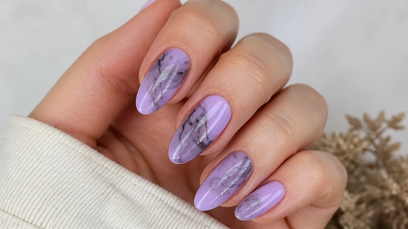 Soft lilac nails with smoky black marble veining