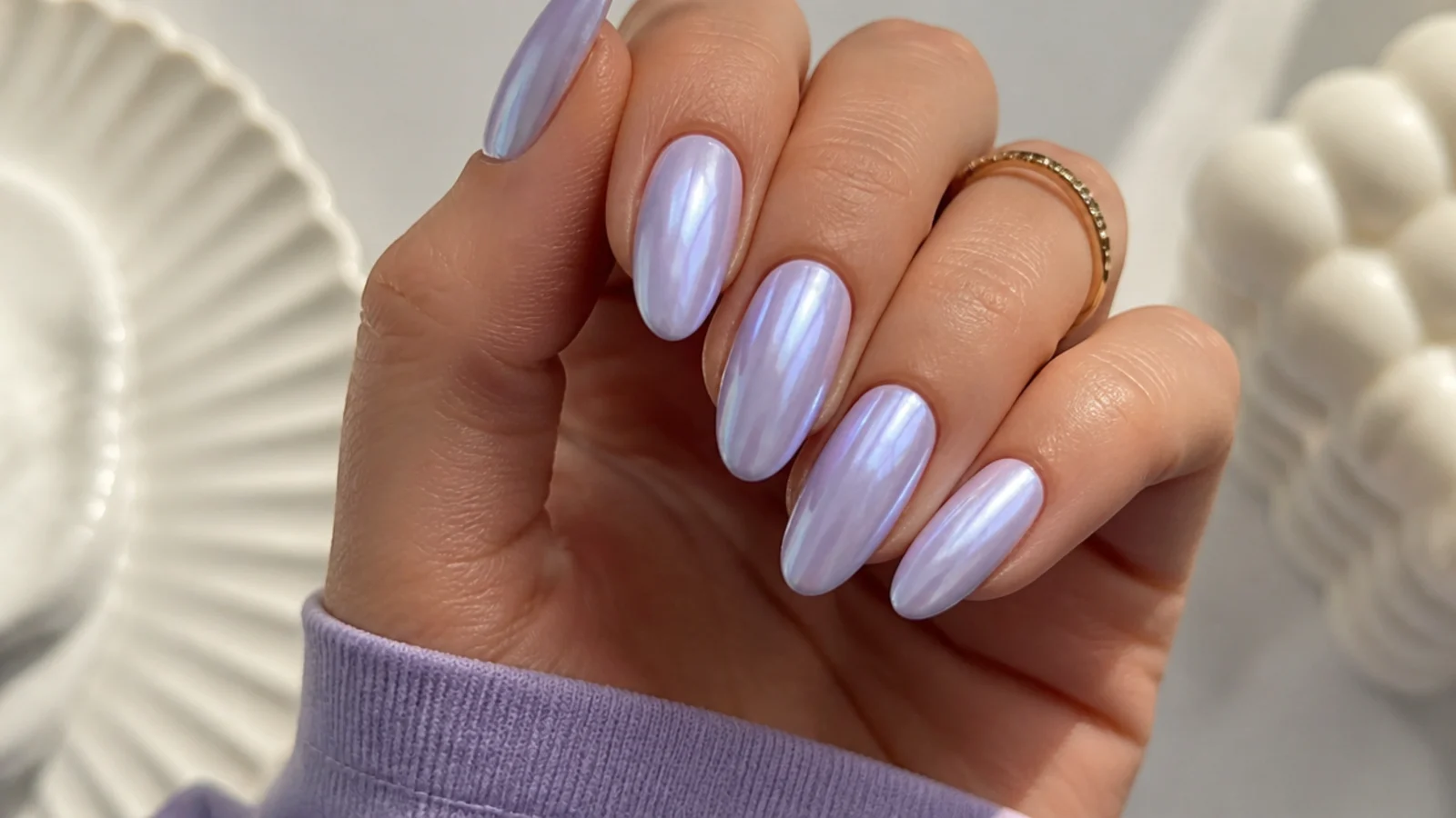 Soft pastel lavender pearl glaze chrome nails with a milky sheen