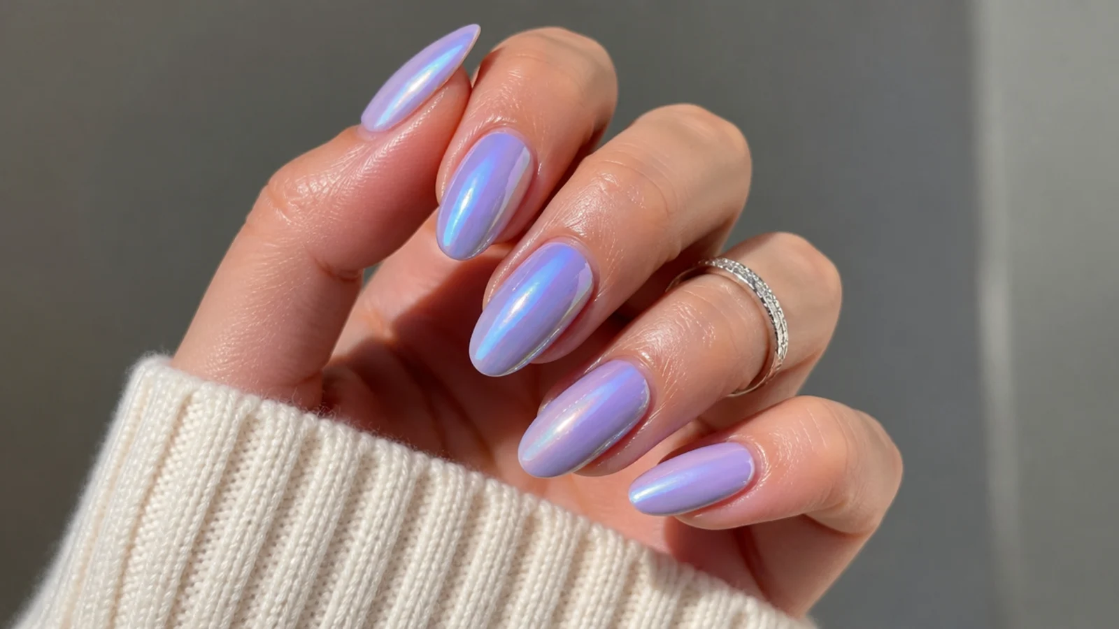 Lilac aurora pearl chrome nails shifting between purple and blue