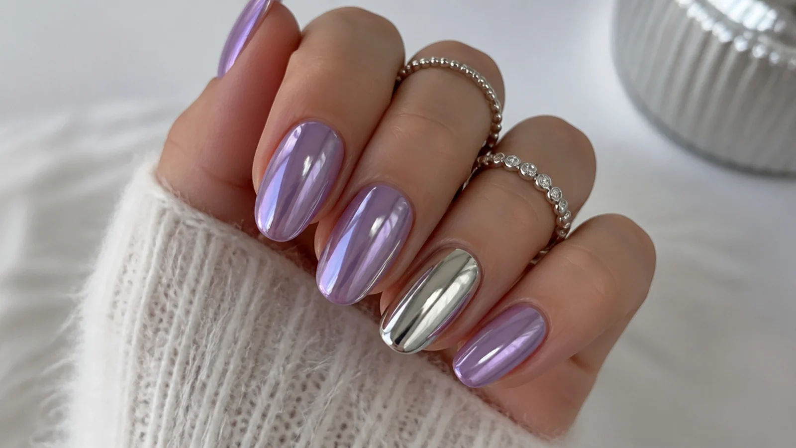 Lilac chrome nails with one bright silver mirror accent nail