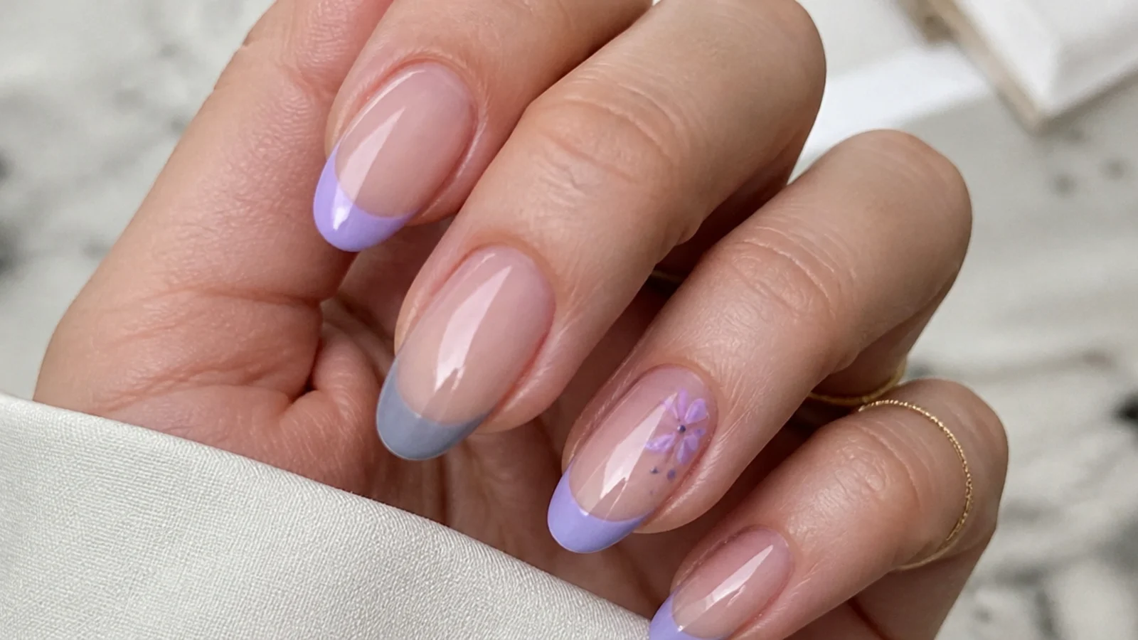 French tips mixing grayed lavender and true lilac shades on nude nails