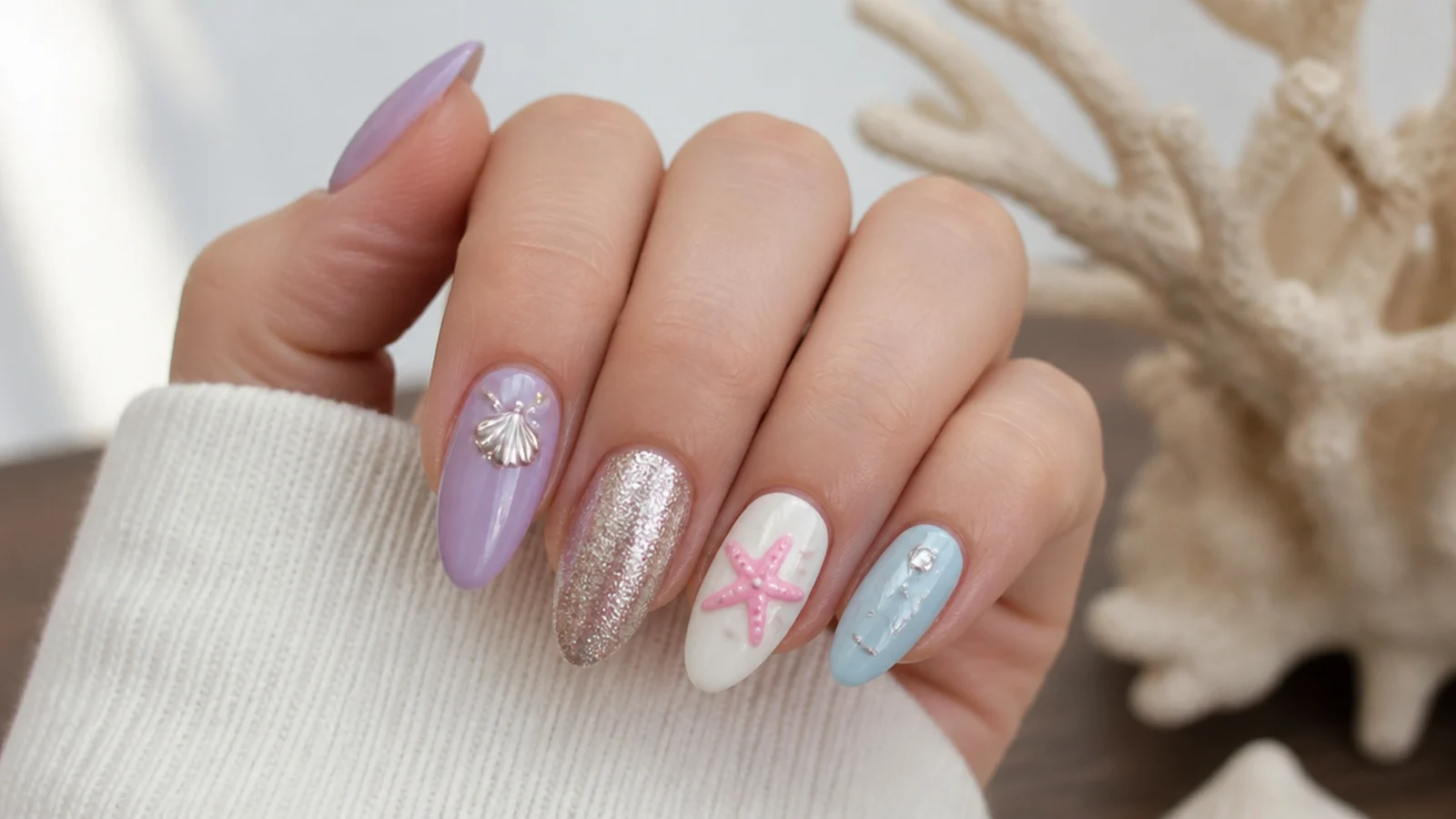 Light purple nails paired with white, silver, pink and light blue accents