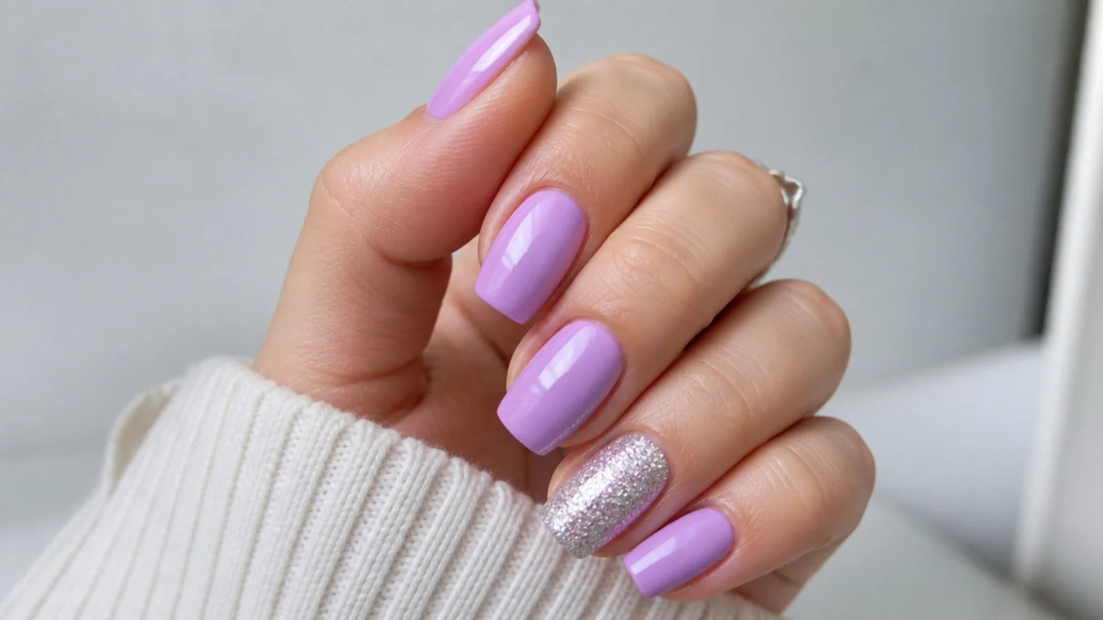 Soft light purple nails with one full silver glitter accent nail