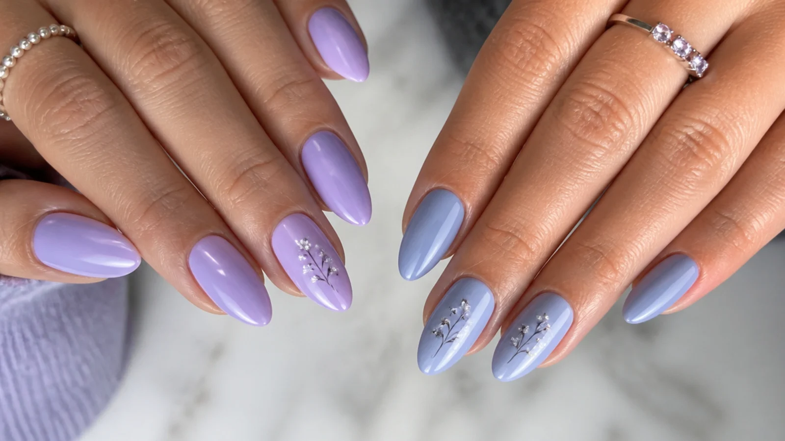 Light purple lilac nails beside cooler gray-blue lavender nails for comparison