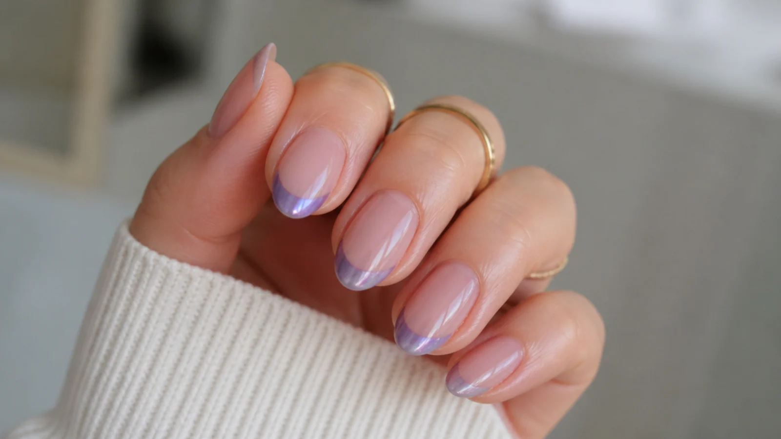 Sheer nude nails with light purple chrome French tips