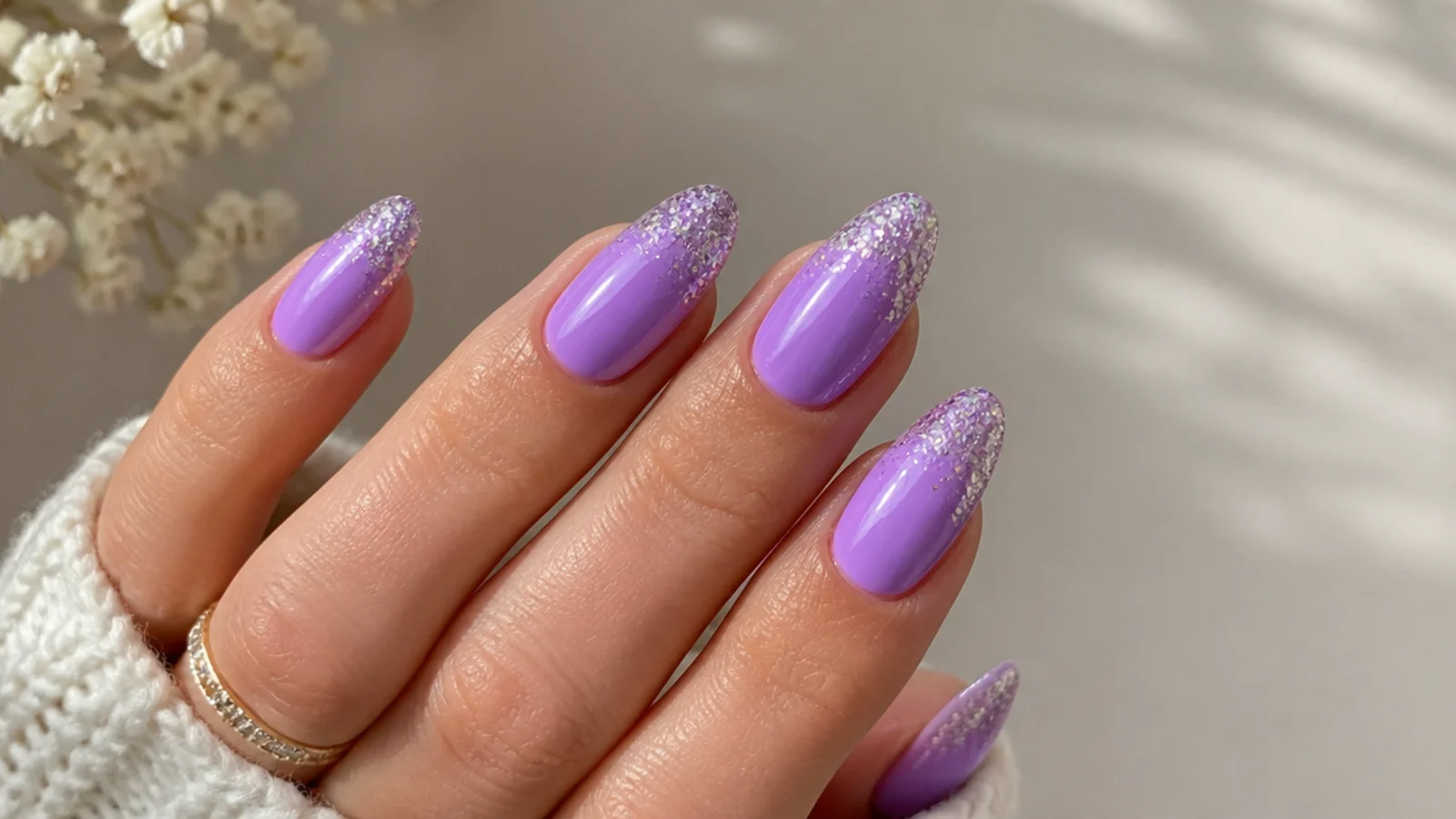 Light purple nails with sparkly glitter-dipped tips