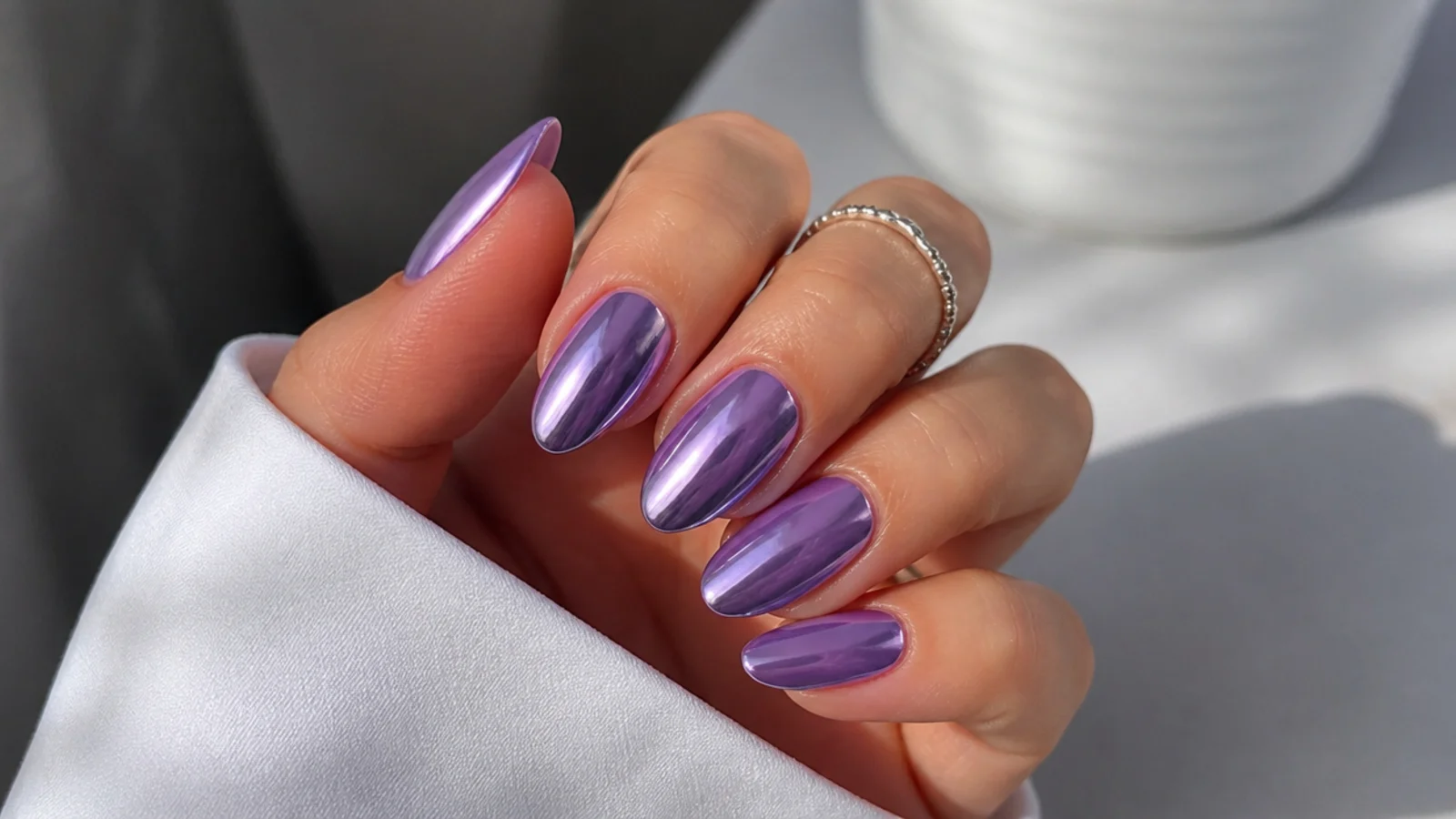 Mirror-finish light purple chrome nails with a metallic shine