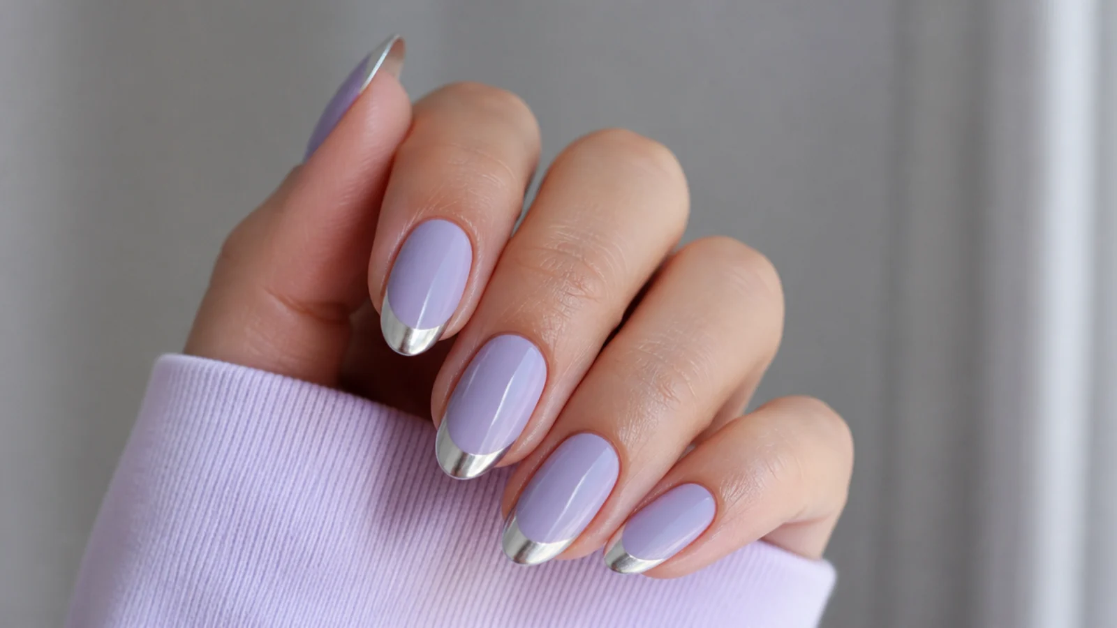 Light purple nails with silver chrome French tips