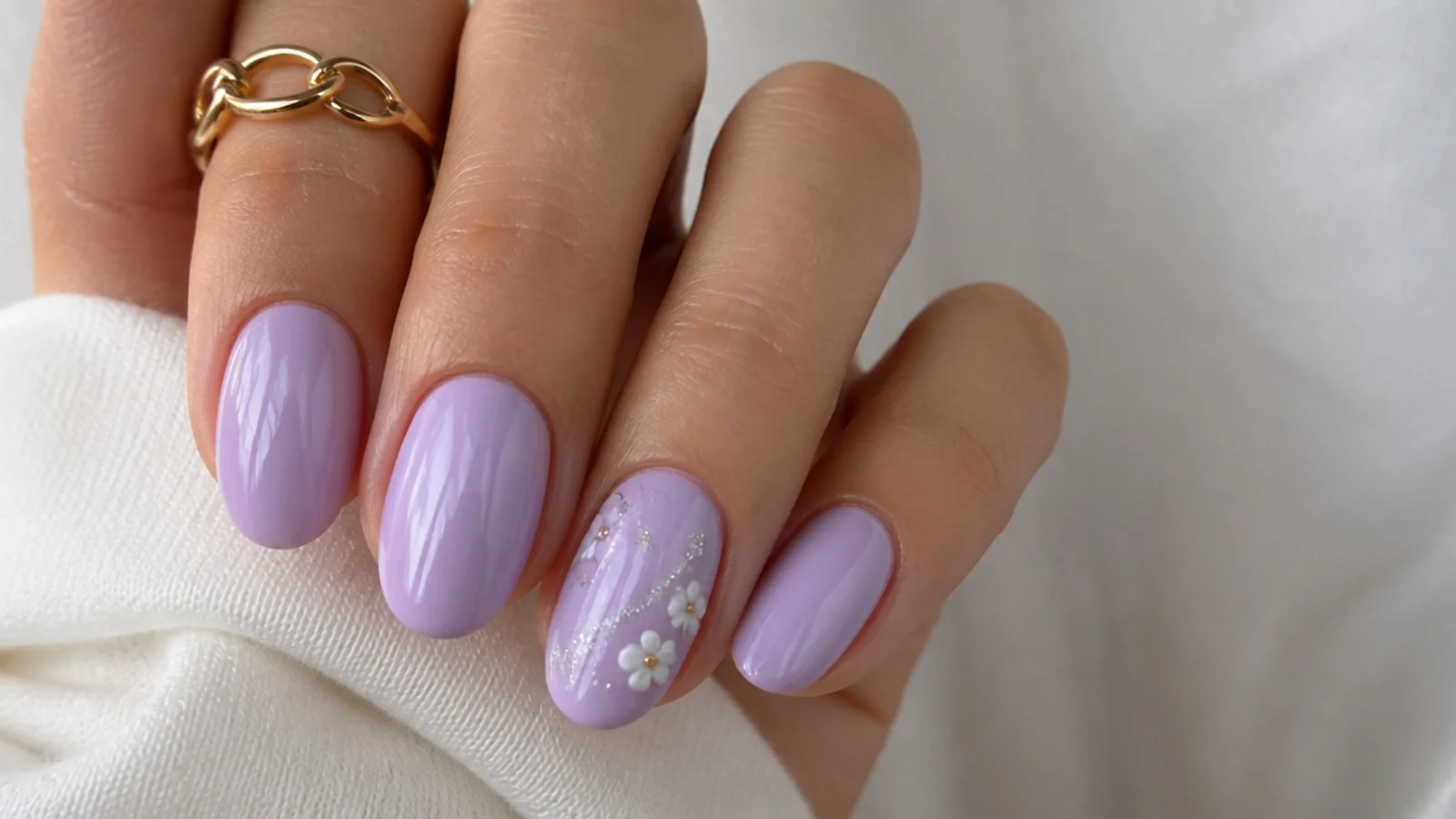 A well-sealed glossy light purple manicure with cuticle oil